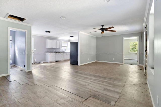 unfurnished living room featuring light hardwood / wood-style flooring, ceiling fan, and ornamental molding