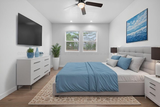 bedroom with ceiling fan and light wood-type flooring