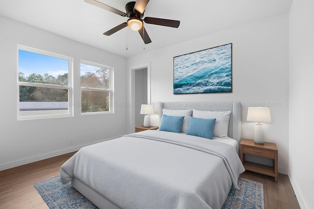 bedroom featuring ceiling fan and hardwood / wood-style floors