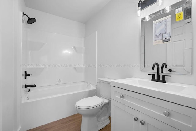 full bathroom with wood-type flooring, vanity, toilet, and tub / shower combination