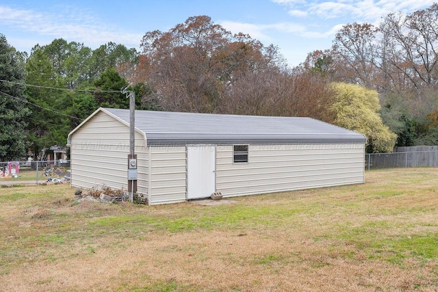 view of outbuilding featuring a lawn