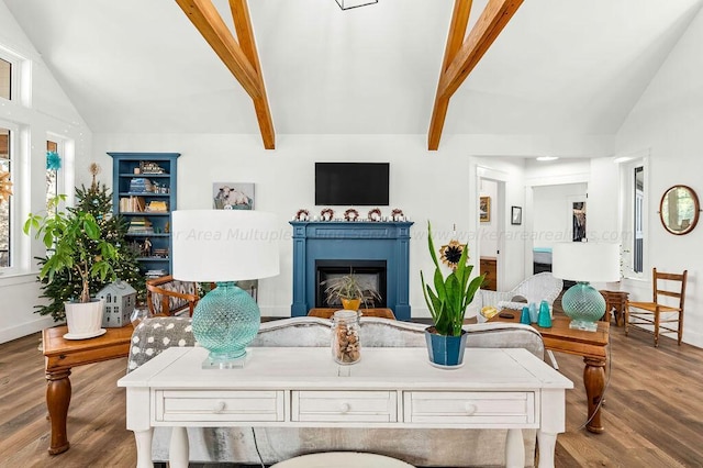 living room featuring hardwood / wood-style floors and lofted ceiling with beams