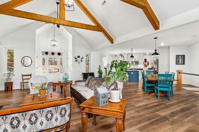 living room featuring high vaulted ceiling, beam ceiling, and hardwood / wood-style floors