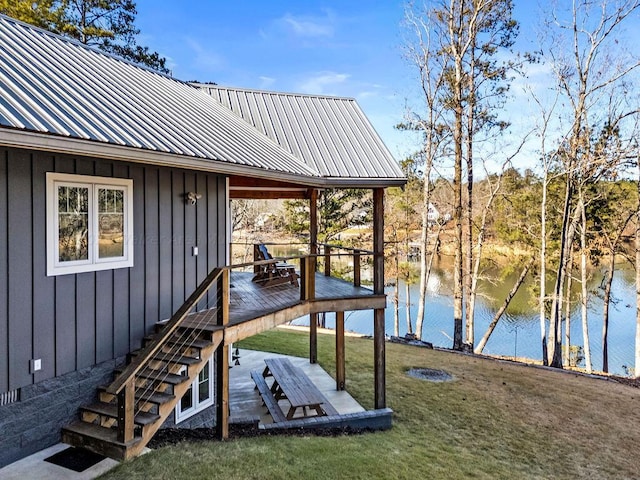 dock area featuring a water view and a yard