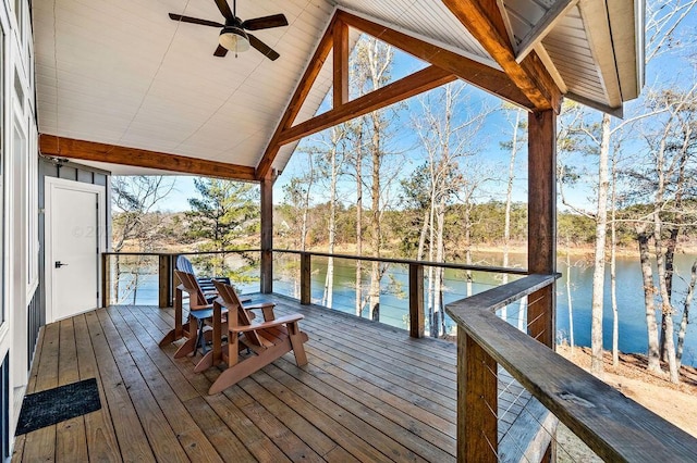 wooden terrace featuring ceiling fan and a water view