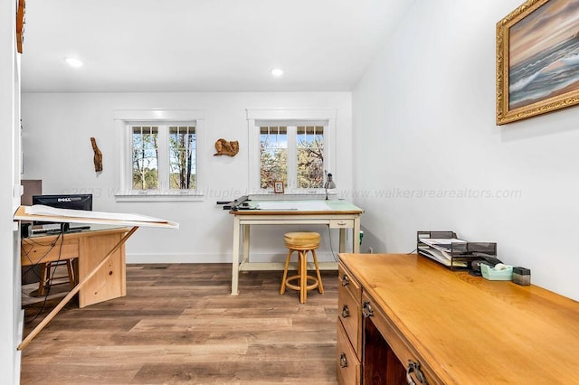 home office featuring light hardwood / wood-style floors