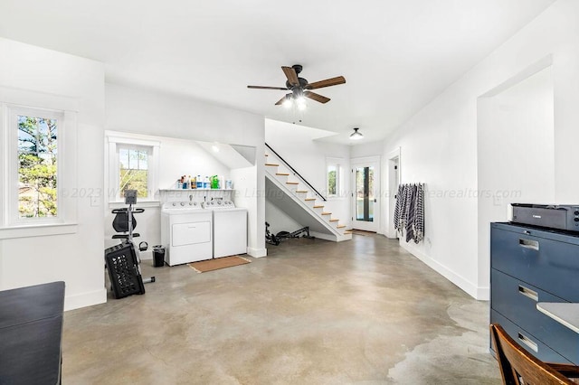 interior space with ceiling fan, concrete flooring, and washer and dryer