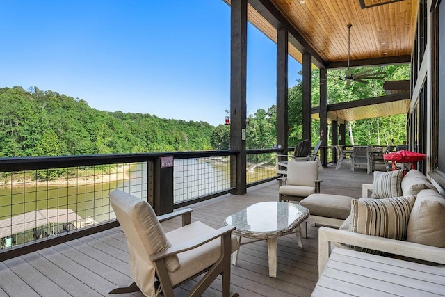 wooden deck featuring ceiling fan