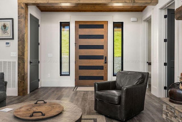 interior space featuring wooden ceiling and dark hardwood / wood-style floors