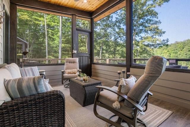 sunroom featuring wooden ceiling