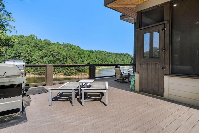 wooden terrace with a water view