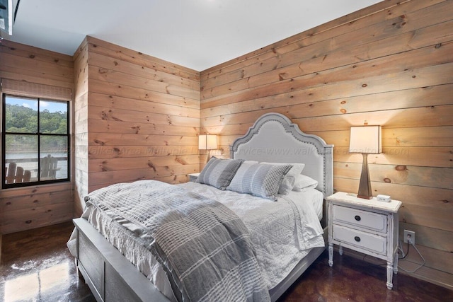 bedroom with wooden walls and dark hardwood / wood-style floors