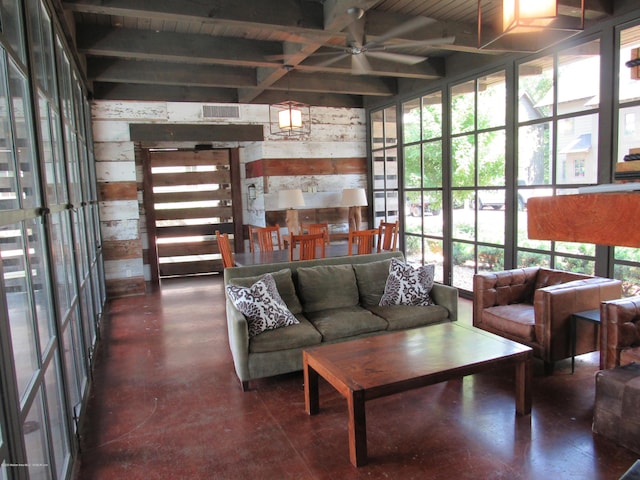 living room with beam ceiling, wooden walls, ceiling fan, and wood ceiling