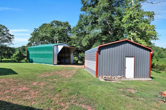 view of outbuilding featuring a lawn and a carport