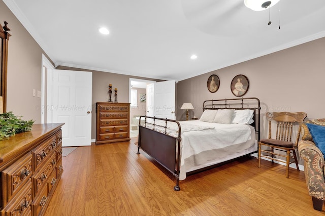 bedroom with ornamental molding and light wood-type flooring