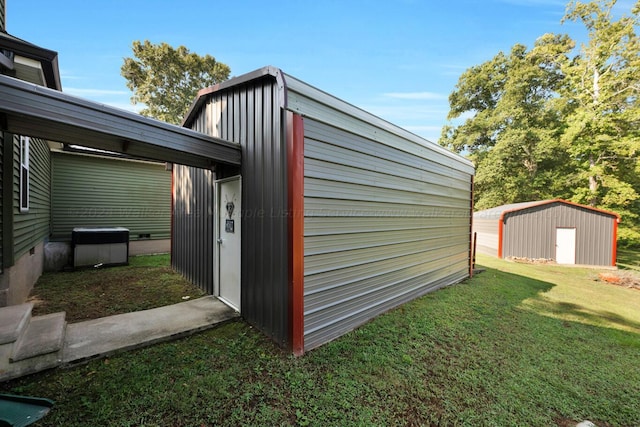 view of outdoor structure with a lawn