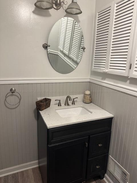 bathroom featuring hardwood / wood-style floors and vanity