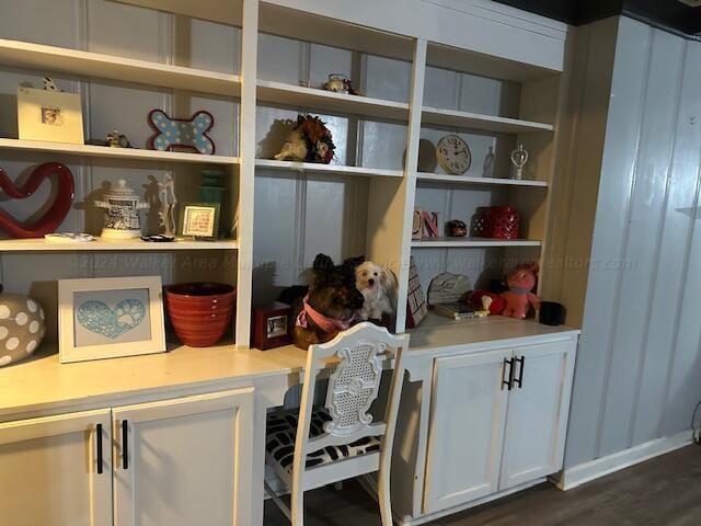 interior space with hardwood / wood-style floors and built in desk