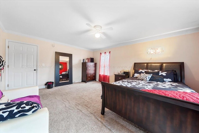 bedroom with baseboards, carpet flooring, a ceiling fan, and crown molding