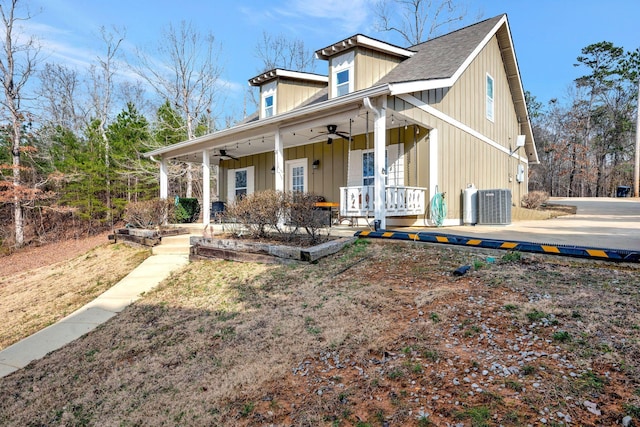 rear view of property featuring ceiling fan, a porch, and central air condition unit