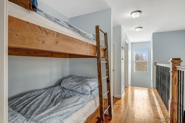 bedroom with hardwood / wood-style flooring