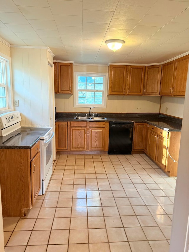 kitchen with brown cabinetry, a sink, dishwasher, dark countertops, and white range with electric stovetop