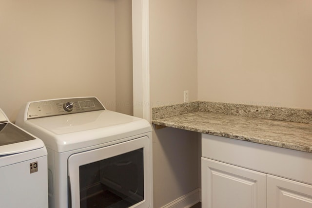 washroom with washer and dryer