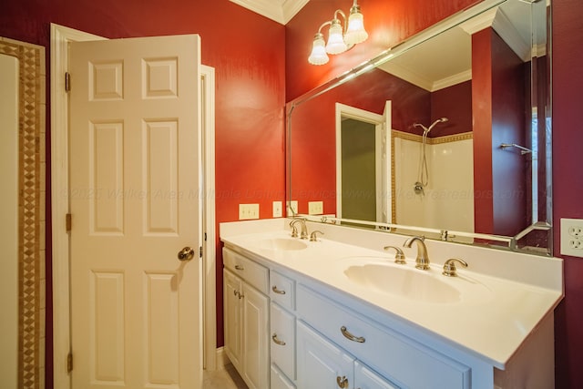 bathroom with crown molding, vanity, and a shower