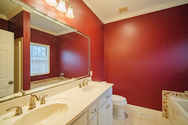 bathroom with a bathing tub, vanity, ornamental molding, tile patterned floors, and toilet