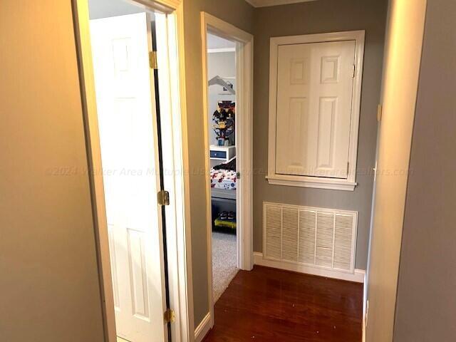 hallway featuring dark wood-type flooring