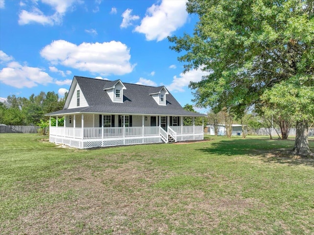 back of property with covered porch and a lawn