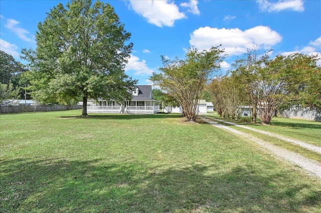 view of yard featuring a sunroom