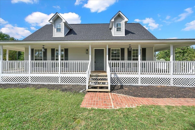 country-style home with covered porch and a front lawn