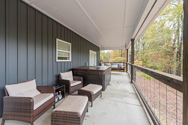 view of patio / terrace with a hot tub and outdoor lounge area