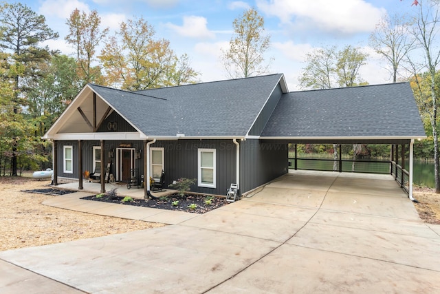 view of front of house with a carport and covered porch