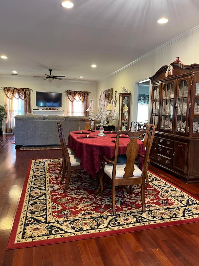 dining room with dark wood-style floors, ornamental molding, a ceiling fan, and recessed lighting