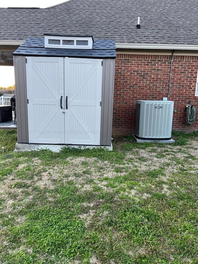 view of shed with central air condition unit