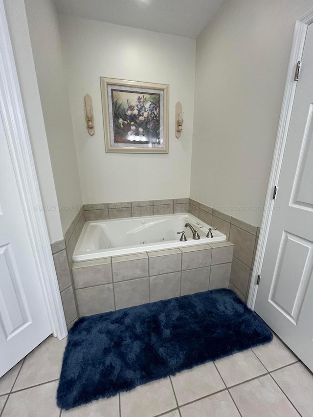 bathroom featuring a garden tub and tile patterned floors