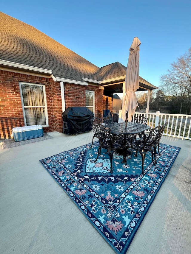 view of patio / terrace featuring outdoor dining space and a grill