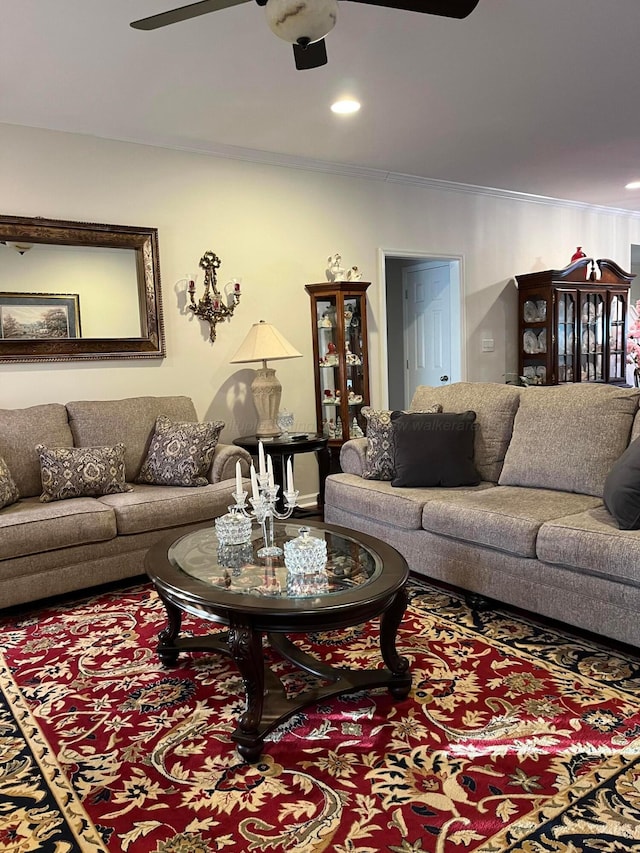 living area featuring a ceiling fan, recessed lighting, and ornamental molding