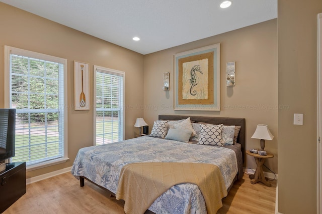 bedroom with light hardwood / wood-style floors