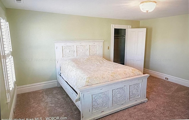 carpeted bedroom with a closet