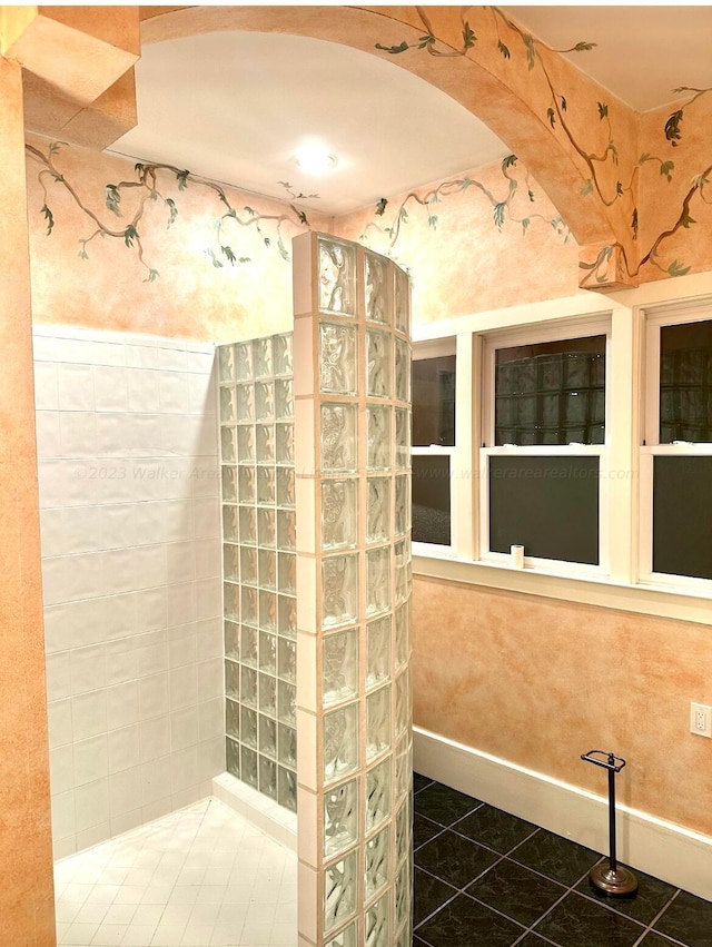 bathroom with tile patterned floors and walk in shower