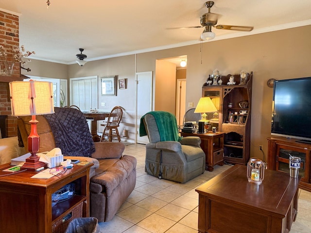 living area with light tile patterned flooring, ceiling fan, and crown molding