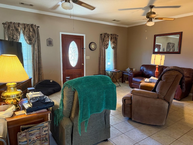 living room featuring a ceiling fan, visible vents, and ornamental molding