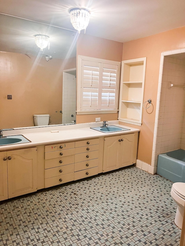 full bathroom with vanity, plus walk in shower, an inviting chandelier, and toilet