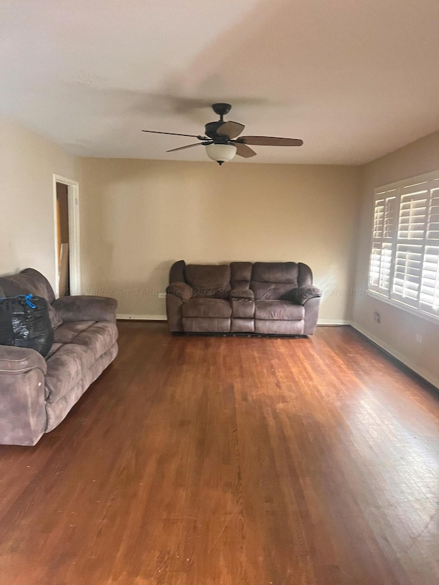 living room with hardwood / wood-style floors and ceiling fan