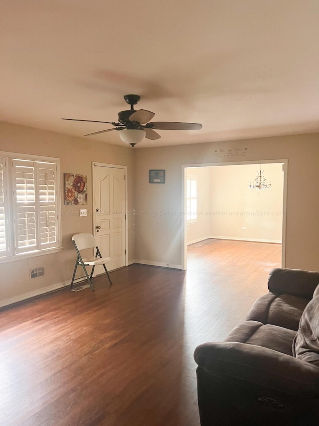 living room with ceiling fan and hardwood / wood-style floors