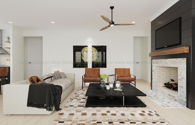 living room featuring ceiling fan, crown molding, and light hardwood / wood-style flooring