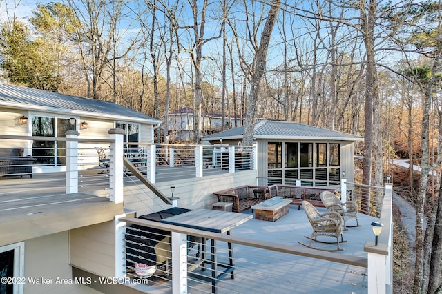 exterior space featuring outdoor lounge area and a sunroom